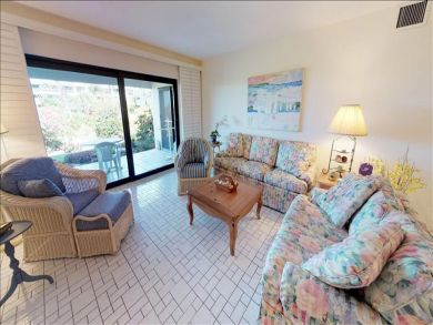 Just Steps to the Sandy Beach from this Two Bedroom Condo